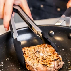 Core tang med silikonspiss 23 cm stål/svart