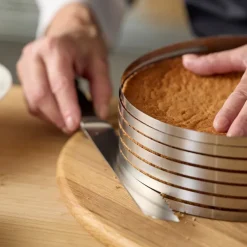 Justerbar kakedeler 24-30x8 cm stål