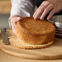 Justerbar kakedeler 24-30x8 cm stål