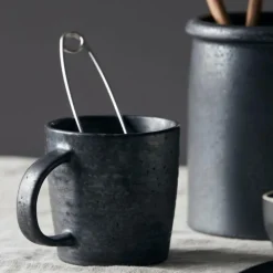 Pion krus 38 cl svart/brun